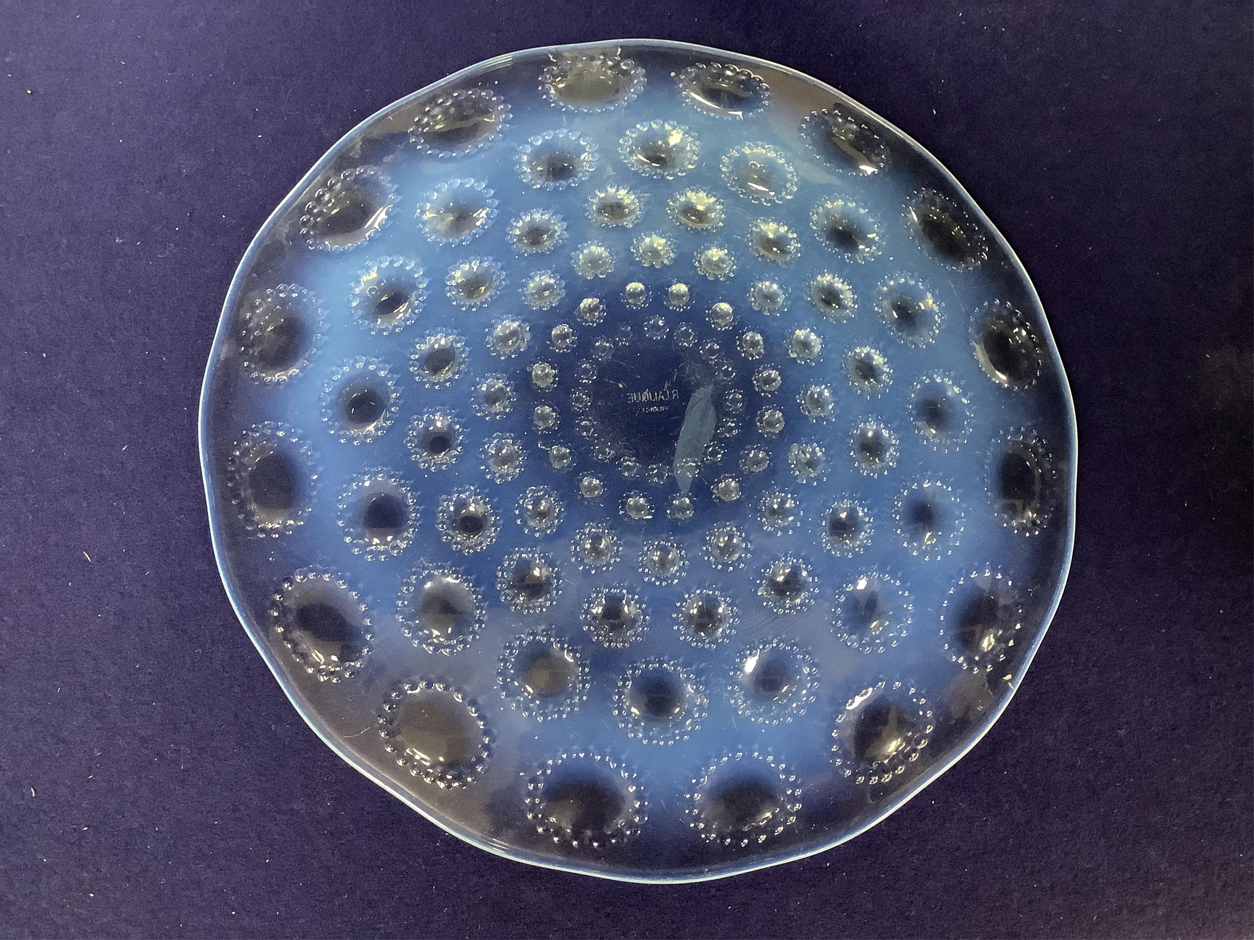 A Lalique Asters coupe-ouverte glass dish, etched R. Lalique France to the base, 28cm in diameter